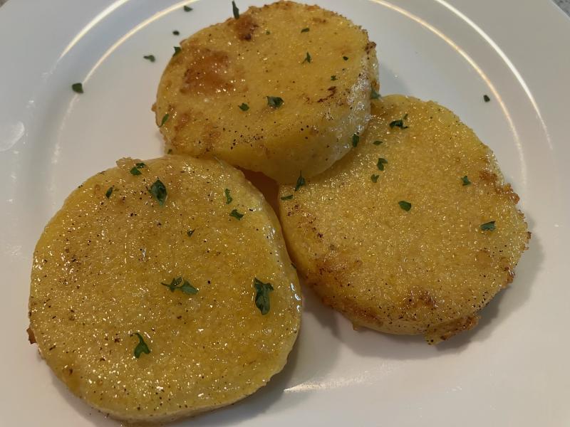Plain polenta cakes can taste bland, but adding herbs or cheese can adapt the flavor to accompany a variety of dishes. JACK CLEMONS PHOTO